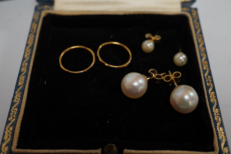 Three pairs of cultured pearl stud earrings, largest 9.3mm diameter, a pair of sleeper earrings, a gold and cultured pearl flower head pendant, stamped 9ct, with a gilt metal chain